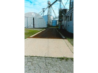 <b>TRACT #1 - GRAIN ELEVATOR</b>  (<b>SOLD - 9/9/16 $110,000</b>)
Note:  The grain bins, drier and legs are on R.R. leased property.  Mr. Voreis stated that lease payment is $900/year.

<b>Improvements - Grain Bins, Drier & Legs:</b>
1994     90,000 bu. bin with air tubes
1994     15,000 bu. hopper bin
               7,000 bu. bin
             42,000 bu. bin with air tube
<b>Drier:</b>  12'x45';1994 Zimmerman grain drier; S.S. 1,500 bu./hr. at 10 pts.;Natural gas
<b>Leg:</b>  1994 110' grain leg; 8,000 bu./hr.
<b>Drier Grain Leg:</b>  5,000 bu./hr.
<b>North Leg:</b>  7,000 bu./hr.
<b>Top Conveyor:</b>  1994 Chain Conveyor
<b>Bottom Conveyor:</b>  U-Trough Auger
<b>Dump Pit:</b>  Approx. 150 bu. with auger to leg

<b>Office:  Portable</b>  A 10' x 50' office with 2 separate offices, customer counter area, 1 restroom

<b>Grain Probe:</b>  A Hyd. Grain Probe

<b>Scales:</b>  10' x 60' Metal deck, scales, load cells, 100,000 lb. capacity, digital read-out and printer

<b>Quonset:</b>  A 41' x 120' metal Quonset building with concrete floor, top auger with 70,000 bu. capacity.

<b>Shop:</b>  A 22' x 40' wood frame with metal siding, concrete floor, heater

<b>Rail Siding:</b>  7+ Car rail siding along the east side of the grain bins.

<b>Utilities:</b>  City - Water and sewer; Electric - 480 (4) phase; Gas - Nipsco 

<FONT FACE="Arial, Helvetica, sans-serif" size="2" color="#0000FF"><b>TRACT #2 - STORAGE WAREHOUSE</b> (<b>STILL AVAILABLE</b>)

<b>2 Lots, Improvements</b>  60' x 112' wood frame structure, concrete floors, 4 doors, dock high load-out.</font face>



 - Grain Elevator (SOLD - 9/9/16) Storage Warehouse Still Available
